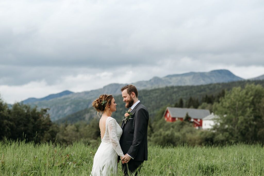 A bride and groom outdoors surrounded by nature