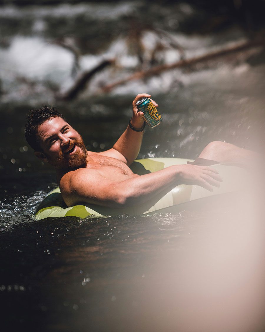 A man tubing on a river